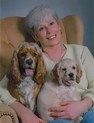 Photo of Carmella Williams and her two dogs